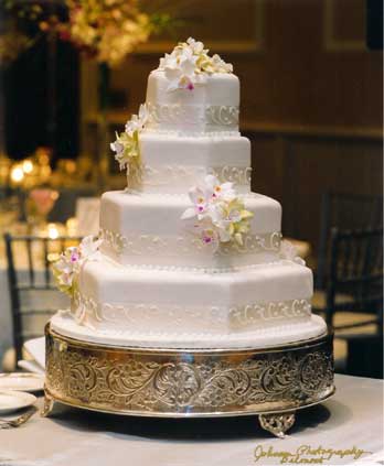 The white cake great for weddings all year round has four tiers and a lot 